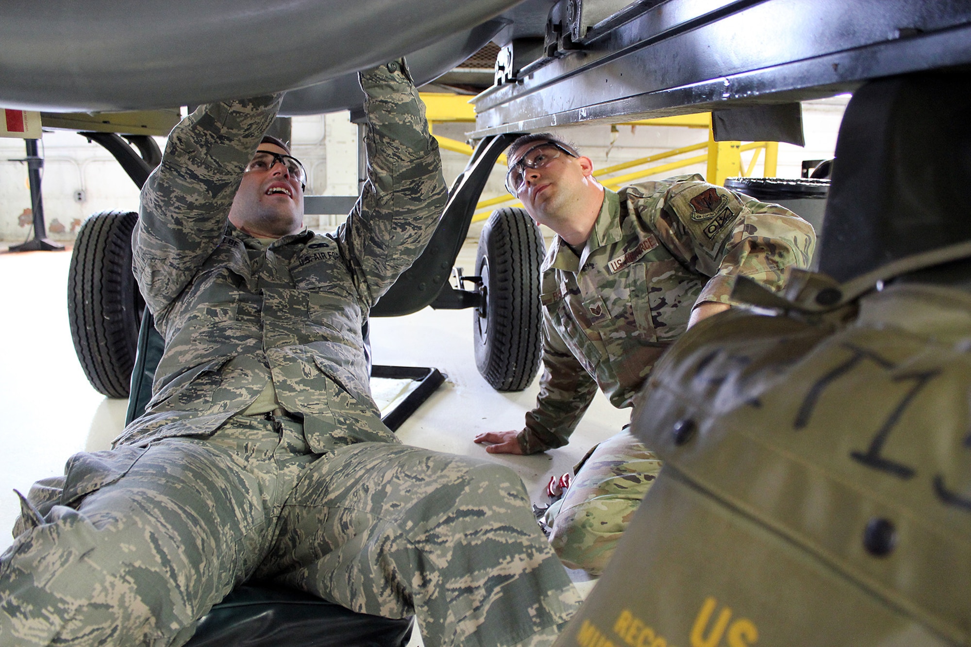 Staff Sgt. Andrew Kolbe works on a T34 engine alongside Staff Sgt. Chris Fisher, at Selfridge Air National Guard Base, Mich., June 6, 2020. The T34 is used on the A-10 Thunderbolt II aircraft assigned to Selfridge. Kolbe was receiving upgrade training as a jet propulsion specialist with the 127th Maintenance Group. (U.S. Air National Guard photo by Tech. Sgt. Dan Heaton)