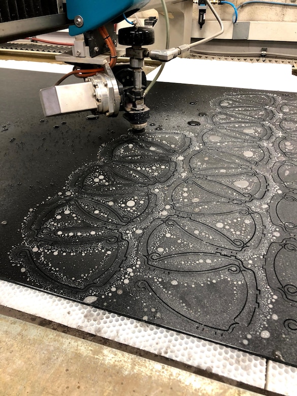 NAWCAD Lakehurst uses a water jet to produce face shield visors. (U.S. Navy photo)