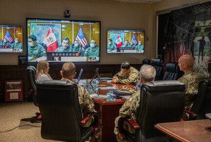 Leadership of the West Virginia National Guard (WVNG) held a video conference call with their State Partnership Program (SPP) counterparts in Perú to discuss COVID-19 military response efforts and best practices June 11, 2020. Maj. Gen. James Hoyer, Adjutant General of the WVNG, and Command Sgt. Maj. Phillip Cantrell, senior enlisted advisor for the WVNG, along with an interpreter, and SPP-Peru program coordinator, Sgt. 1st Class Hector Guillen, spent an hour discussing COVID-19 efforts with their Peruvian counterparts, including Brig. Gen. Marcos Rodriguez, the commander of the Peruvian Army’s National Support and Development Command. (U.S. Army National Guard photo by Edwin L. Wriston)