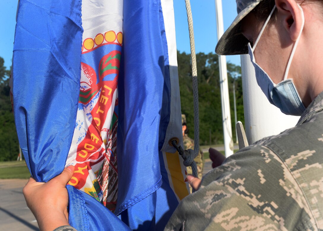 Airman holds Minnesota's state flag