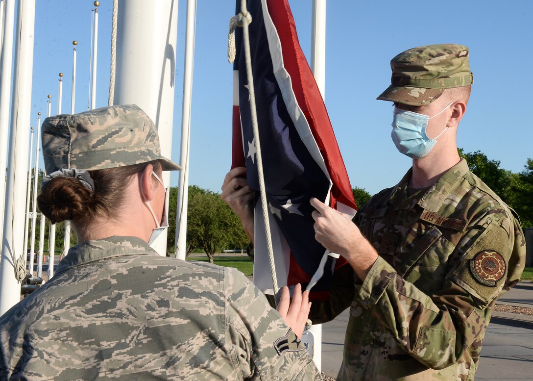 Airmen prepares to raise Ohio's state flag