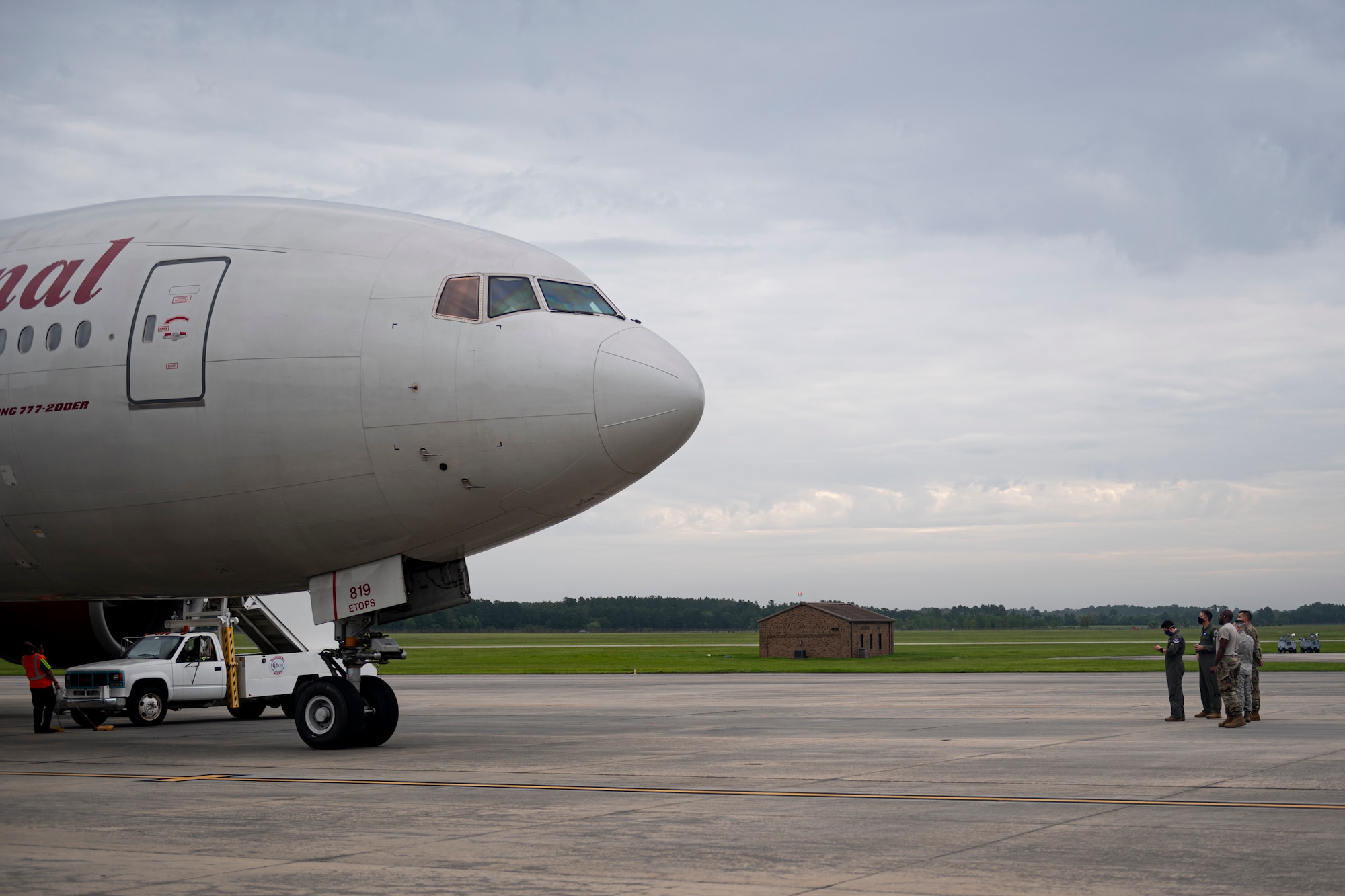 A photo of Airmen waiting for Airmen to deplane