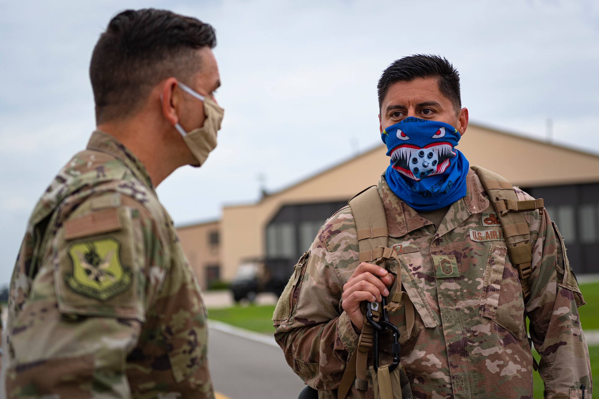 A photo of two Airmen talking