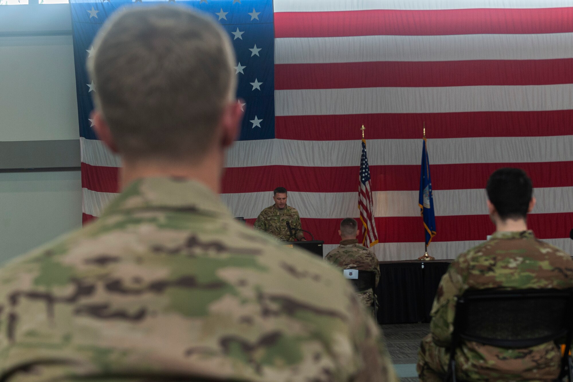 Photo of Col. Walls speaking to graduates
