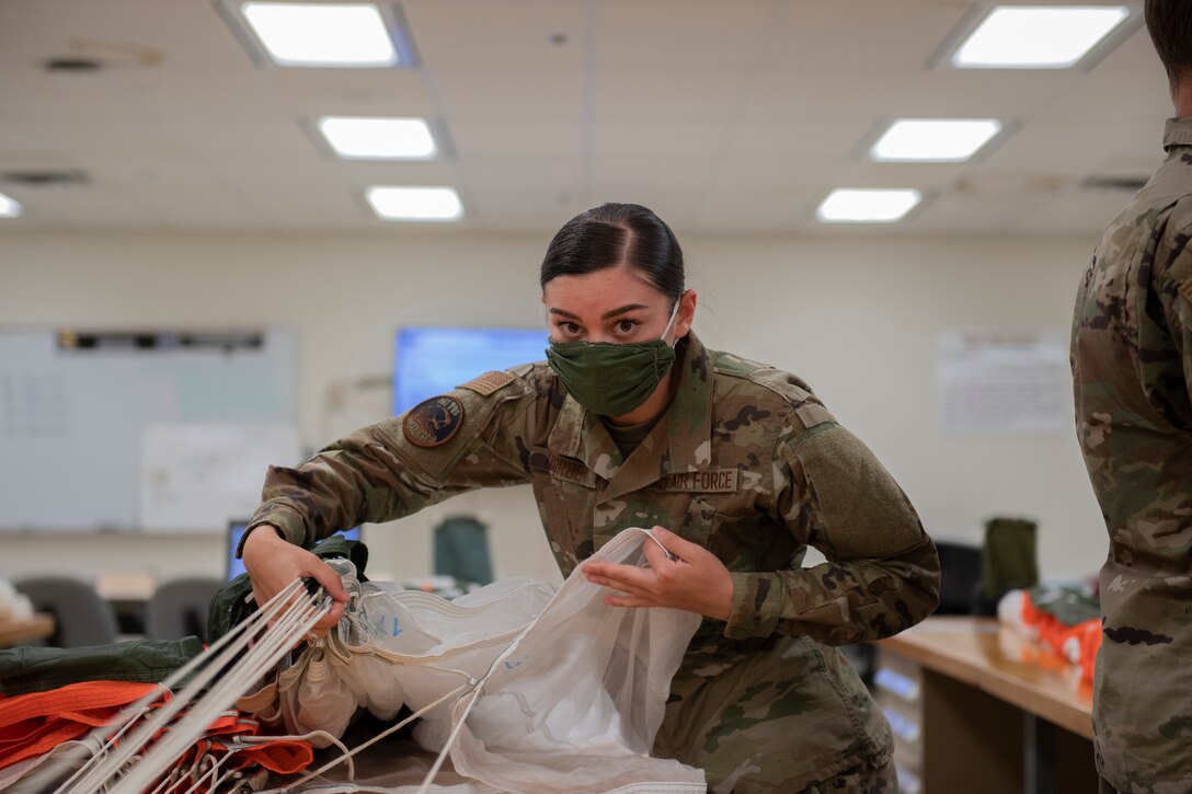 Aircrew Flight Equipment student separates parachute lines