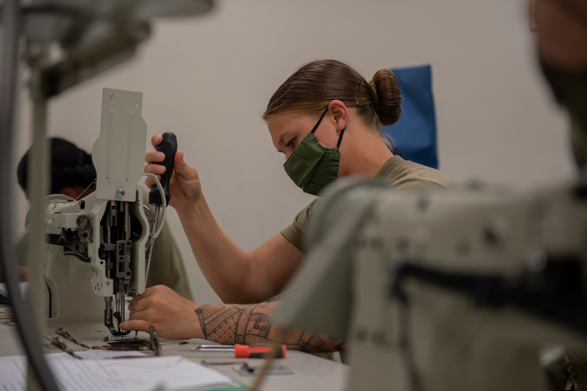 Aircrew Flight Equipment student replaces the feed dog on a 206RB Consew sewing machine