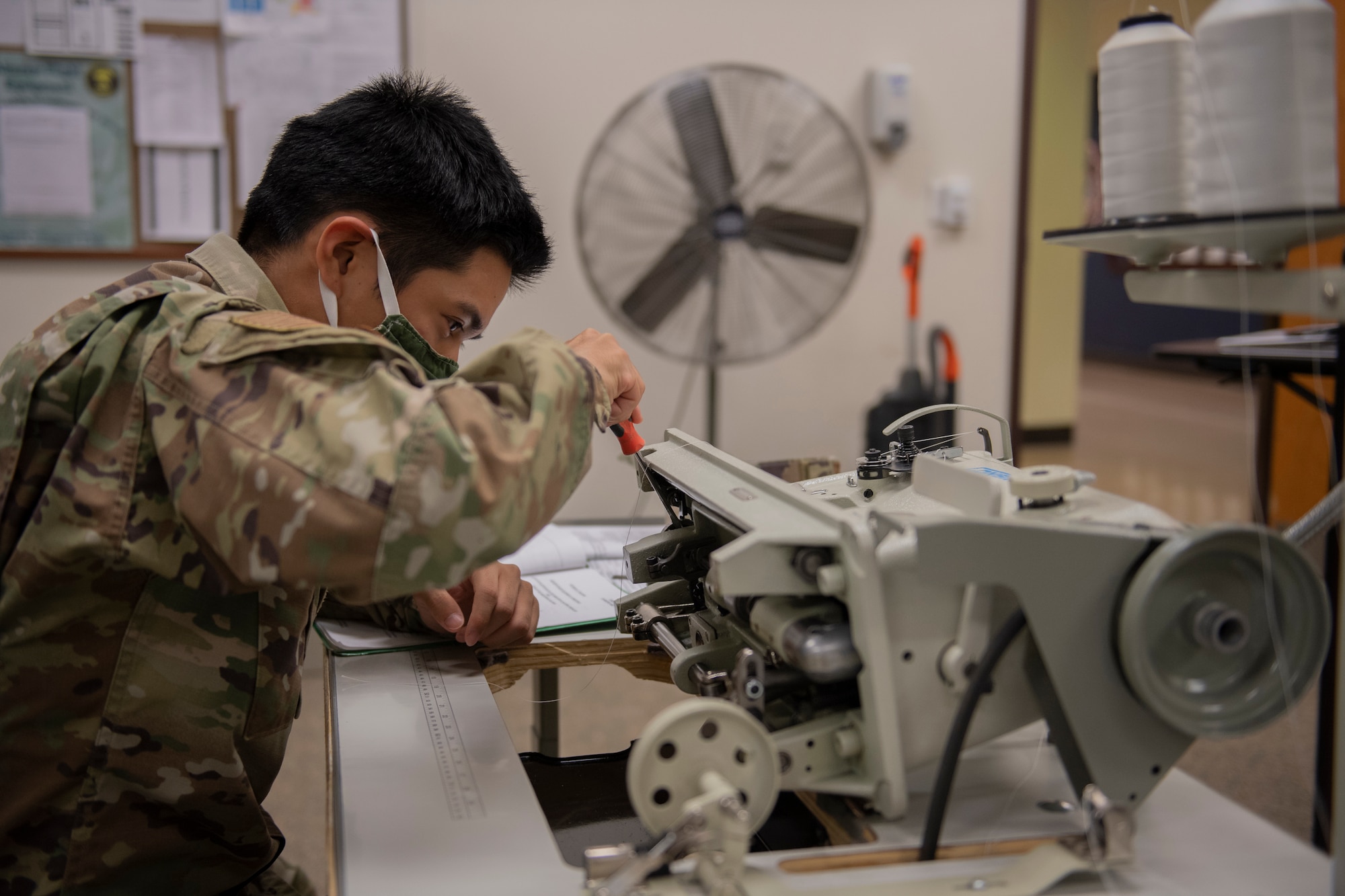 Aircrew Flight Equipment student works on 206RB Corsew sewing machine