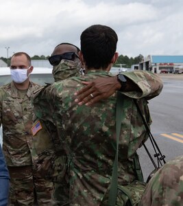 Members of the Romanian delegation say goodbye to their Alabama National Guard counterparts before boarding their plane to fly home from Montgomery, Alabama, June 9, 2020.  The visit was part of the National Guard Bureau’s State Partnership Program which allows for the exchange of knowledge and experience between the Alabama National Guard and the Romanian Ministry of Defense.