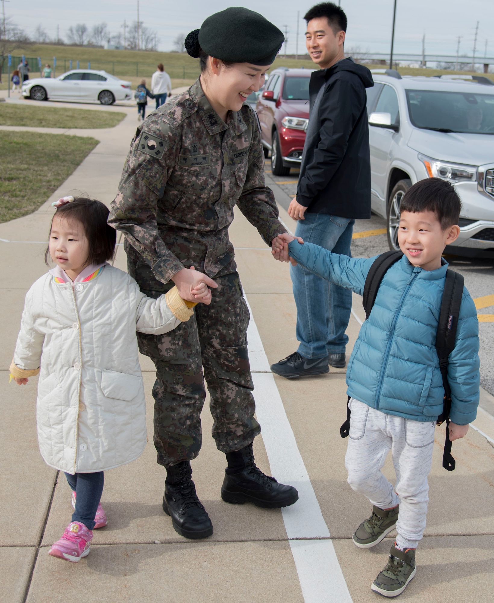 Maj. Paek with her husband and children after school.