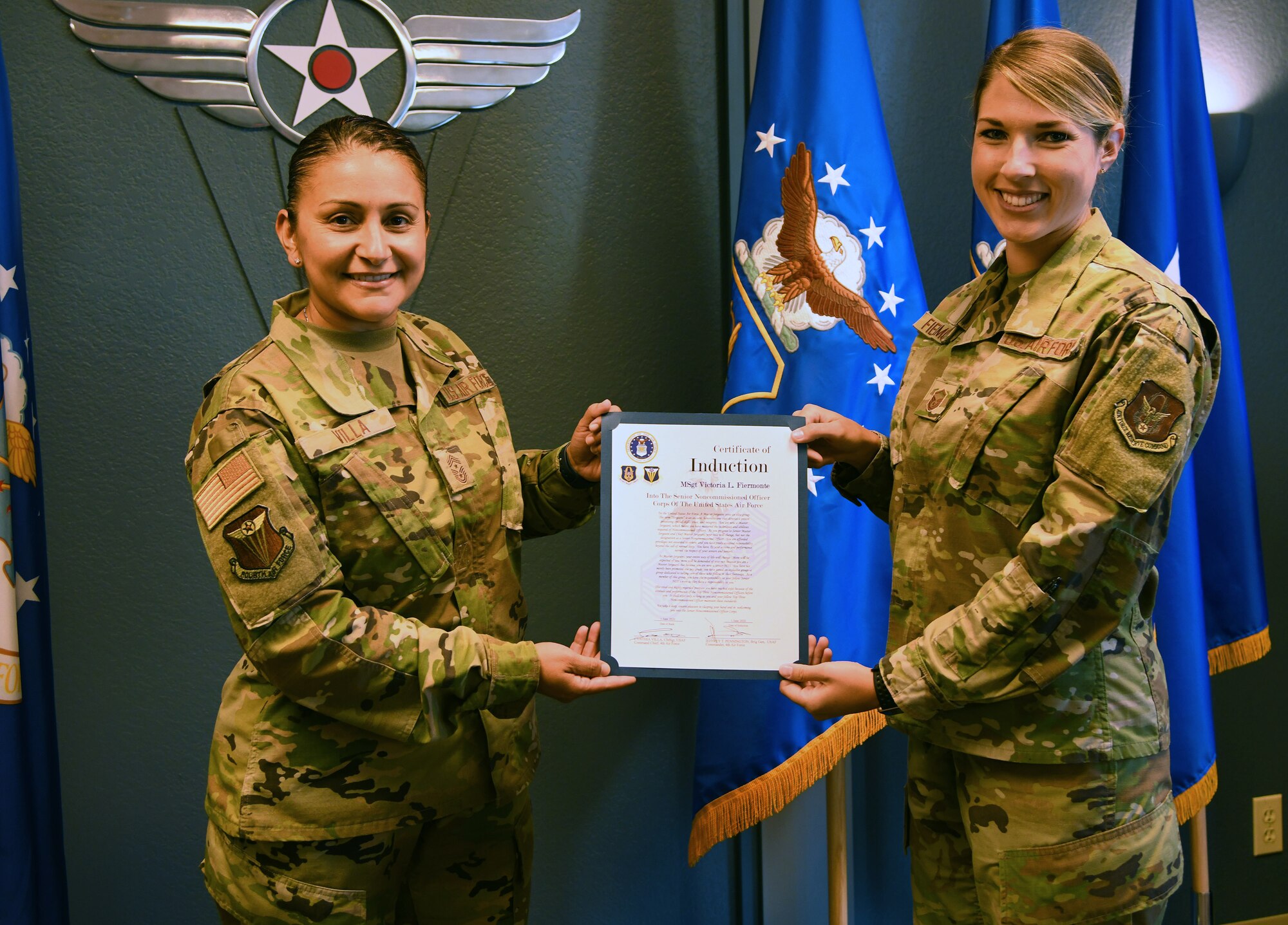 Chief Master Sgt. Cynthia Villa, (left), Fourth Air Force command chief, present Master Sgt. Victoria Fiermonte with her Senior NCO induction certificate. Fiermonte is executive assistant for the Fourth Air Force command chief. As the executive assistant, Fiermonte's responsibilities range from project management and travel arrangements to organizing
teleconferences and event planning. (U.S. Air Force photo by Candy Knight)
