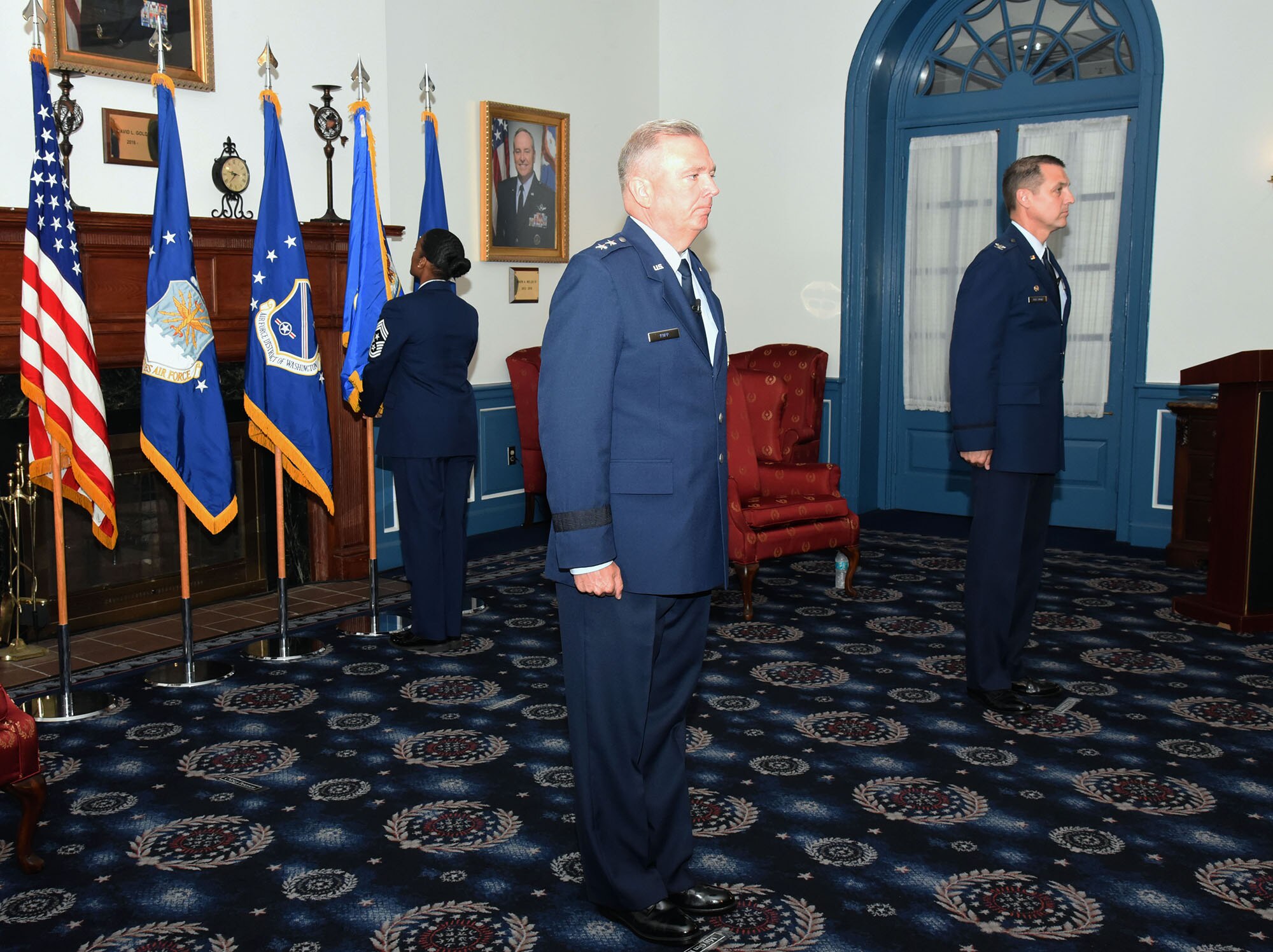 U.S. Air Force Chief Master Sgt. Christy Peterson, 11th Wing command chief, posts the 11th Wing flag while U.S. Air Force Maj. Gen. Ricky Rupp, Air Force District of Washington commander, and U.S. Air Force Col. Mike Zuhlsdorf, 11th Wing and Joint Base Anacostia-Bolling commander, stand at attention during the wing activation and assumption-of-command ceremony on Joint Base Anacostia-Bolling, Washington D.C., June 12, 2020. The 11th Wing -- The Chief’s Own was activated on the base in preparation for assuming host-wing responsibilities. The base will officially transfer from Navy to Air Force responsibility in October 2020. (U.S. Air Force photo by 1st Lt. Kali L. Gradishar)