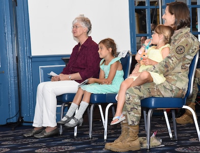 The family of Air Force Col. Mike Zuhlsdorf, Joint Base Anacostia-Bolling commander, smiles as they are welcomed to the 11th Wing and Air Force District of Washington family by Maj. Gen. Ricky Rupp, AFDW commander, during the 11th Wing activation and assumption-of-command ceremony on Joint Base Anacostia-Bolling, Washington D.C., June 12, 2020. The 11th Wing -- The Chief’s Own was activated on the base in preparation for assuming host-wing responsibilities. The base will officially transfer from Navy to Air Force responsibility in October 2020. (U.S. Air Force photo by 1st Lt. Kali L. Gradishar)