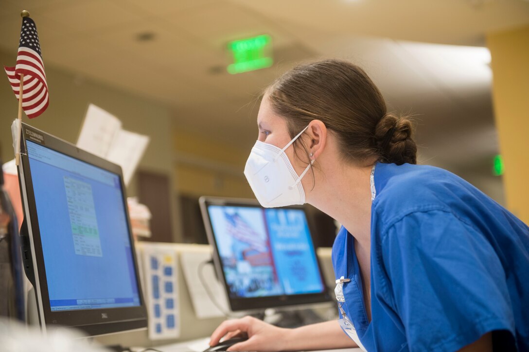 Air Force Capt. Lisbeth Whaley, an emergency trauma nurse with Urban Augmentation Medical Task Force 811-1, enters information into a computer at Stamford Hospital-Bennett Medical Center, Stamford, Conn., May 14, 2020. U.S. Northern Command, through U.S. Army North, remains committed to providing flexible Department of Defense support to the Federal Emergency Management Agency for the whole-of-nation COVID-19 Response. (U.S. Air Force photo by Senior Airman Nicholas Dutton)