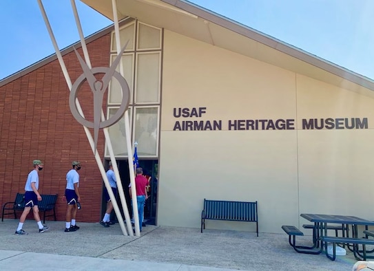 Photo of basic military training trainees at exhibits the Airman Heritage Museum.