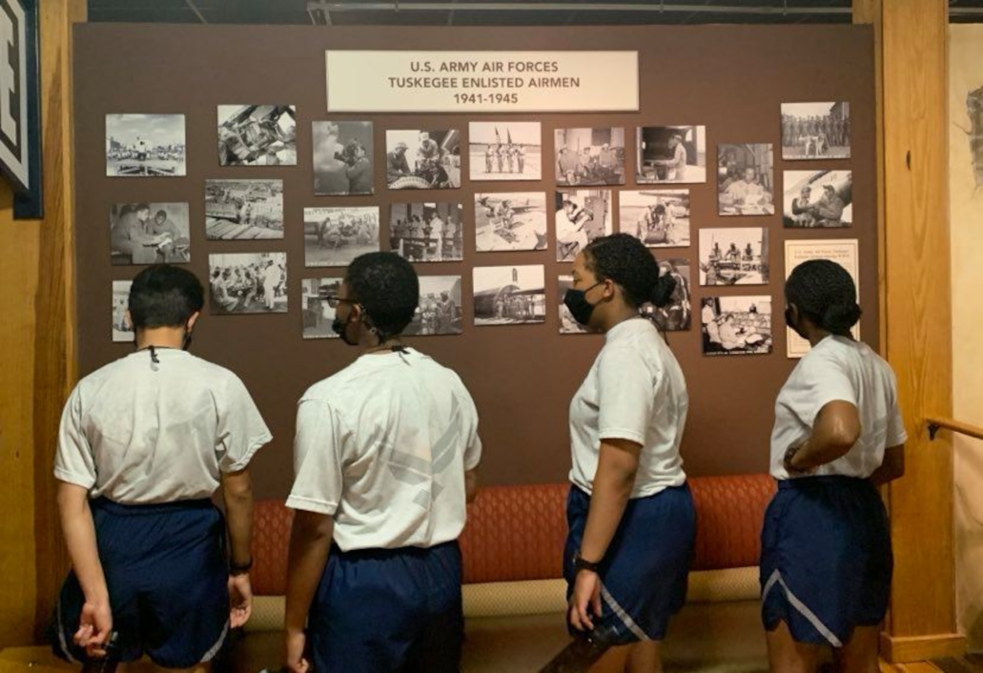 Photo of basic military training trainees at exhibits the Airman Heritage Museum.