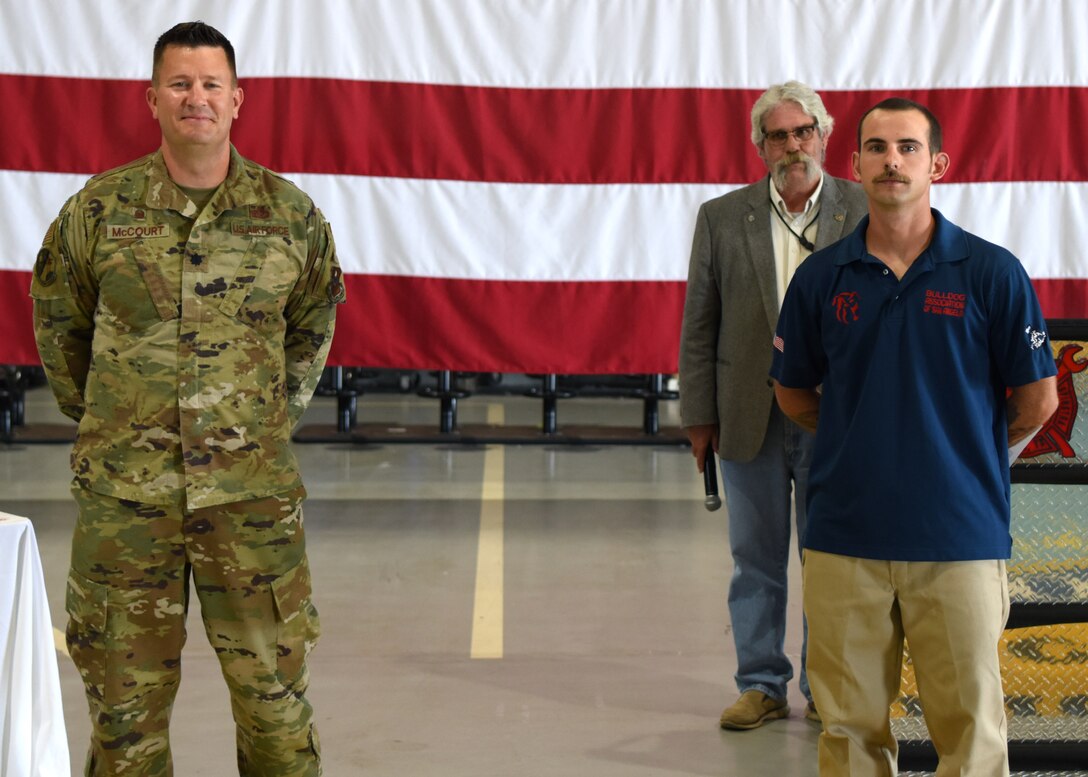 U.S. Air Force Lt. Col. Michael McCourt, 312th Training Squadron commander, poses with Fire Instructor, Mr. Alex Blackwell, who won the Department of Defense Fire Academy U.S. Civilian Instructor of the Year Award at the Louis F. Garland DoD Fire Academy on Goodfellow Air Force Base, Texas, June 5, 2020. Blackwell was a Marine fire instructor at the academy and later transitioned to the civilian side. (U.S. Air Force photo by Airman 1st Class Ethan Sherwood)