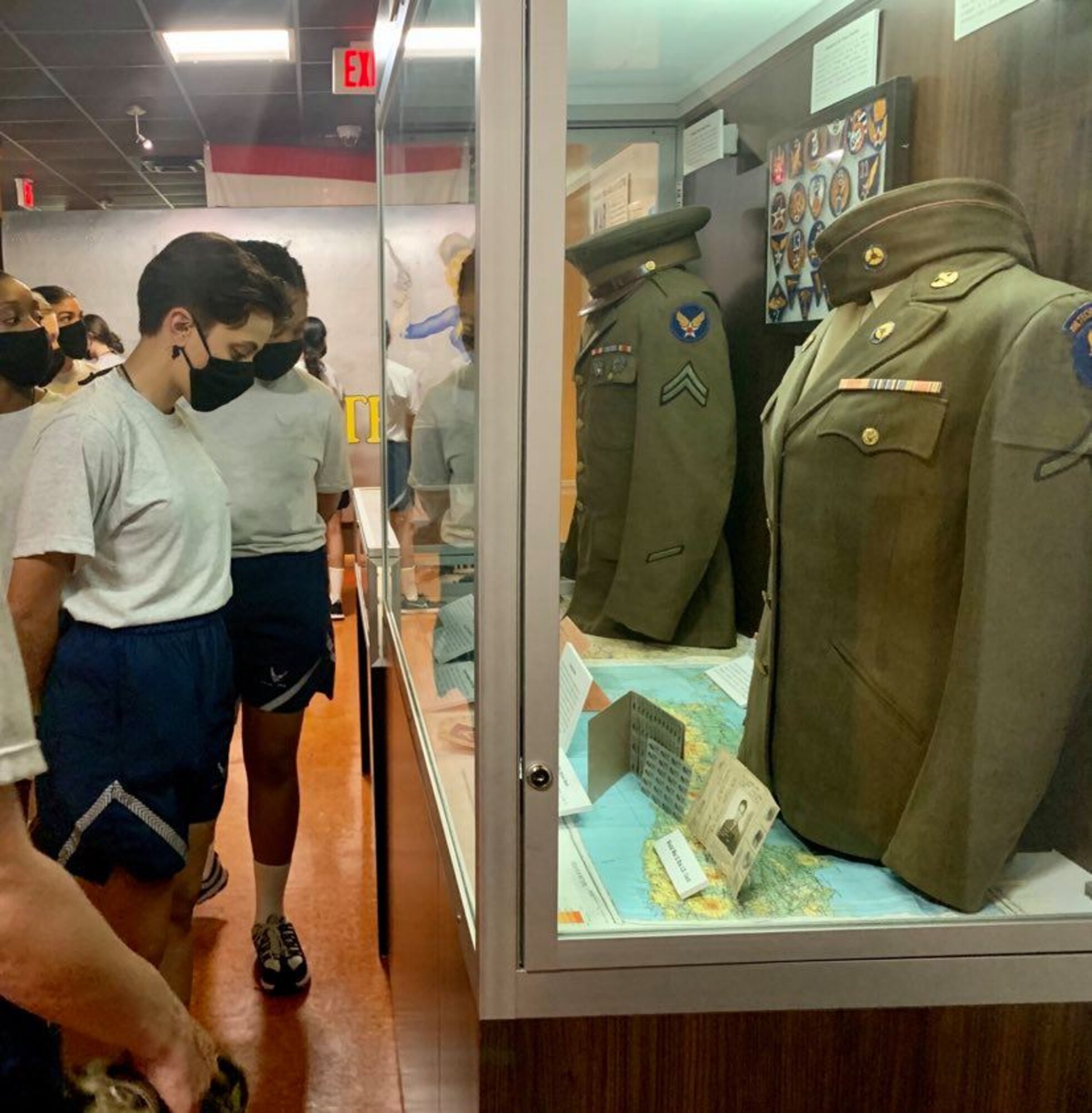 Photo of basic military training trainees at exhibits the Airman Heritage Museum.