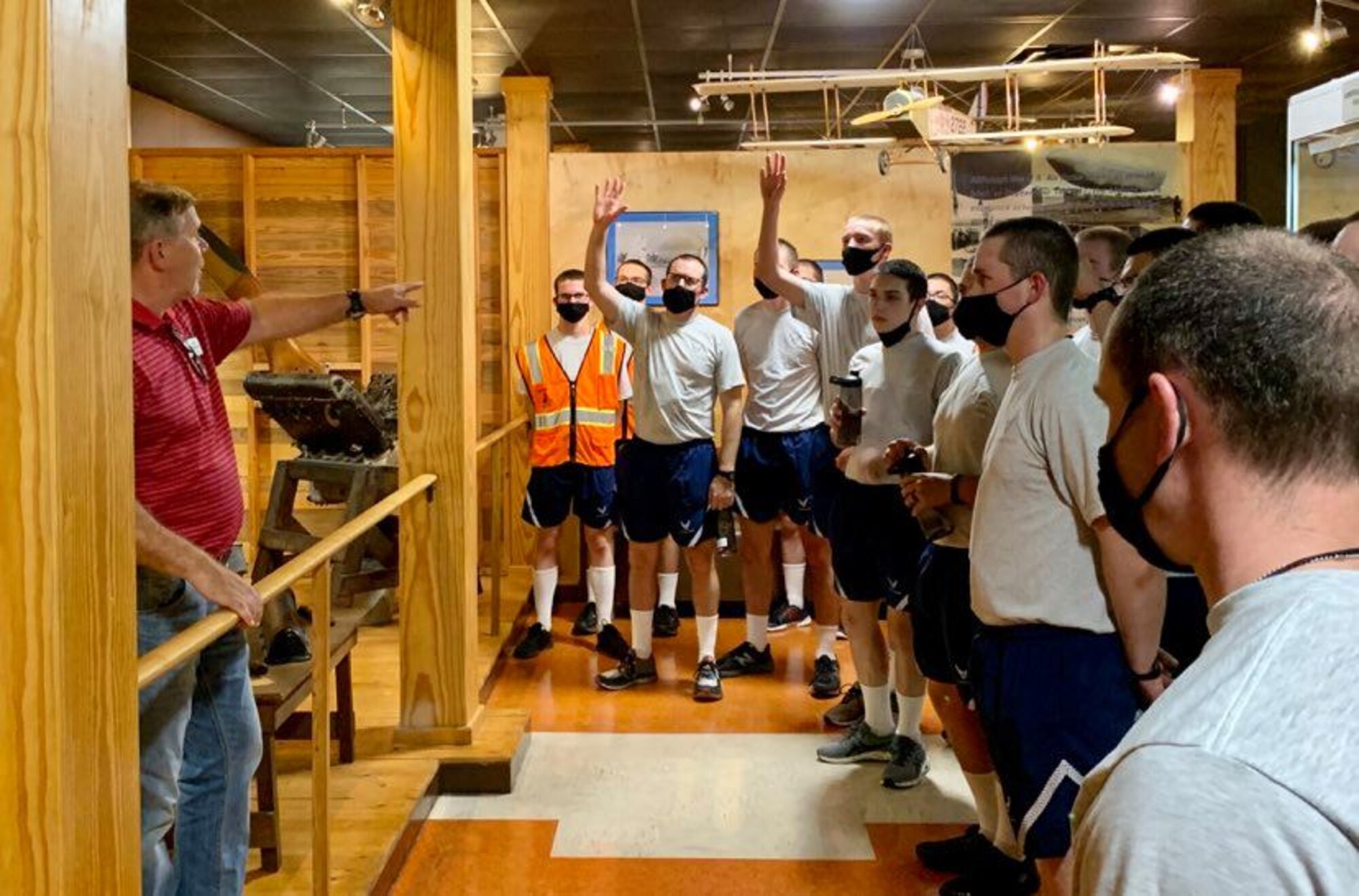 Photo of basic military training trainees at exhibits the Airman Heritage Museum.