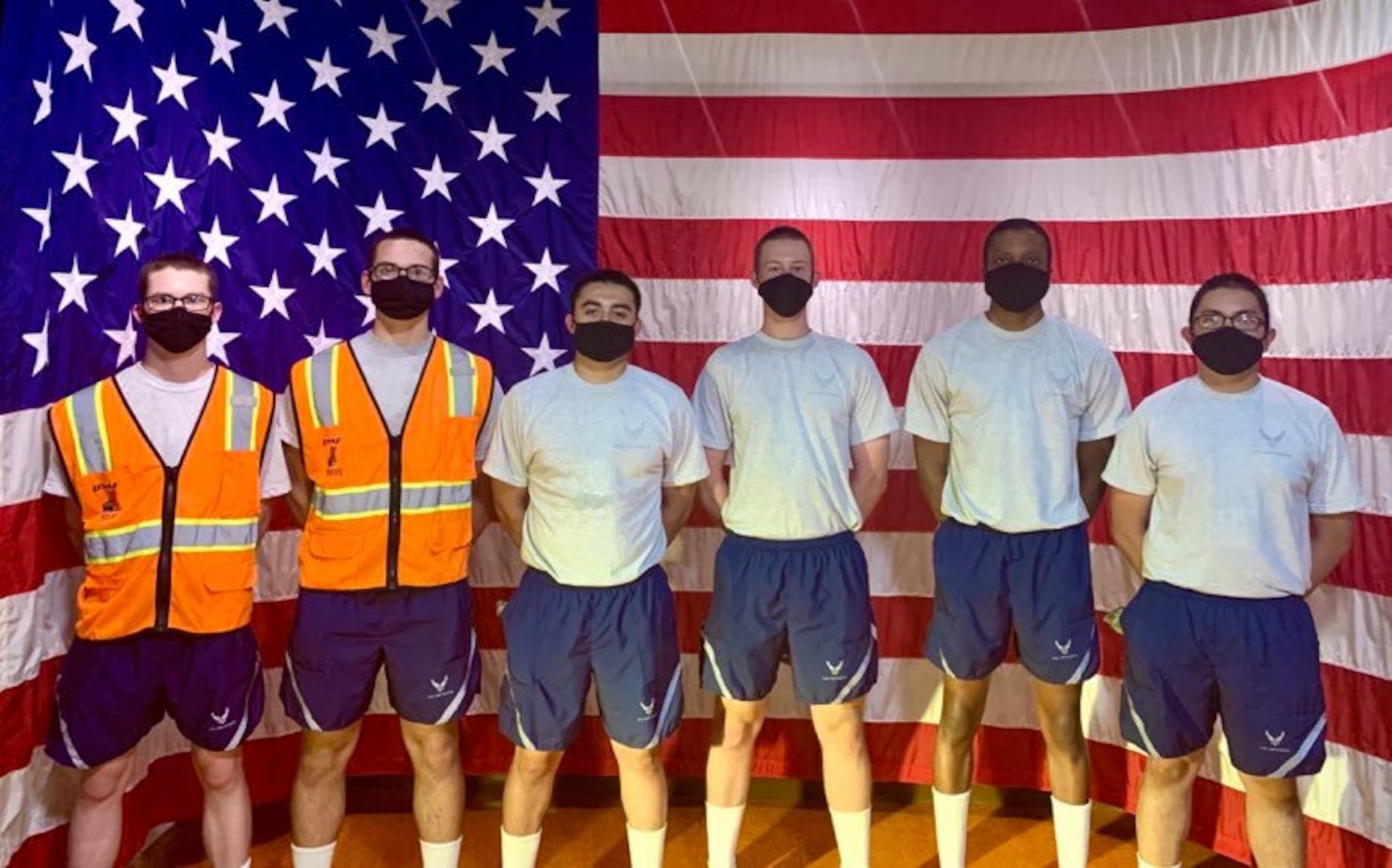 Photo of basic military training trainees pose for a photo at an exhibit in the Airman Heritage Museum.