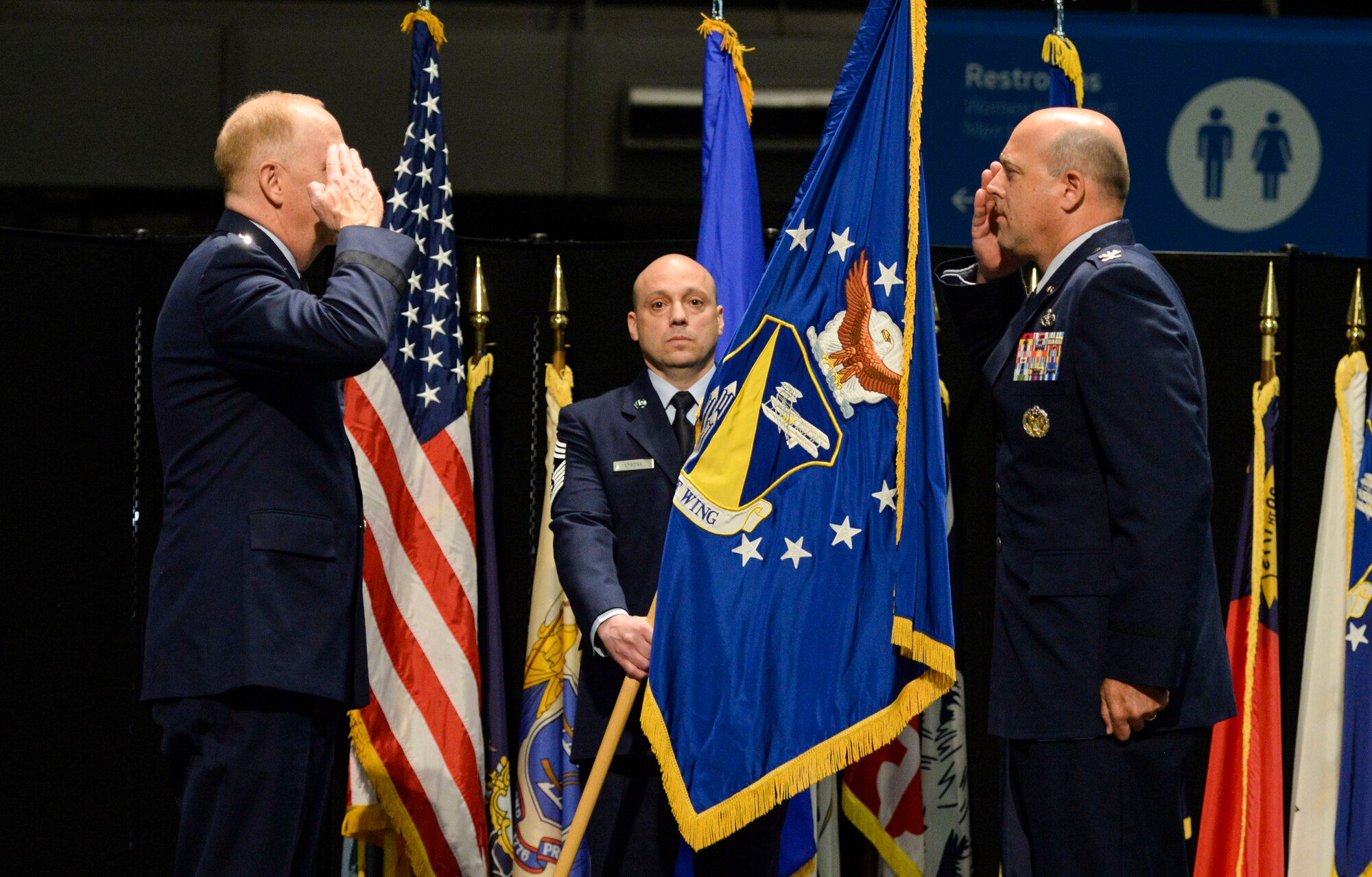 U.S. Air Force Col. Patrick Miller, assumes command of the 88th Air Base Wing from Lt. Gen. Robert McMurry, Air Force Life Cycle Management Center commander, during a change of command ceremony inside the National Museum of the United States Air Force at Wright-Patterson Air Force Base, Ohio, June 12, 2020. Col. Miller replaced Col. Thomas Sherman. This year's change of command ceremony was different from years past with no more than 50 people in attendance but instead broadcasted live over social media and no contact between principles due to the COVID-19 pandemic. (U.S. Air Force photo by Wesley Farnsworth)
