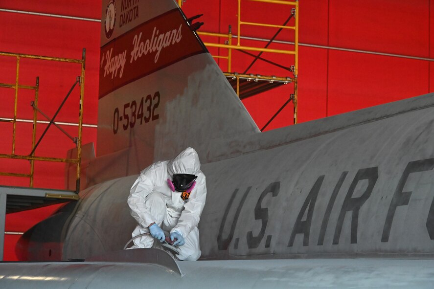 Staff Sgt. Anthony Walp, 119th Aircraft Maintenance Squadron, prepares the surface of an F-102 Delta Dagger static aircraft for a fresh coat of paint at North Dakota Air National Guard Base, Fargo, N.D., June 11, 2020. The aircraft will be returned to Heritage Park when restoration is complete. The North Dakota Air National Guard flew the F-102 from 1966-1969 and the Air Force eventually retired the airframe from operational service in 1976. (U.S. Air National Guard photo by David H. Lipp)