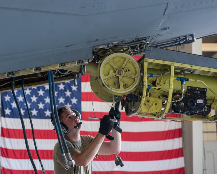 Staff Sgt. Alex Comfer, 914th Maintenance Squadron hydraulics technician, prepares to remove the bolt that holds the boom arm in place on a KC-135R Stratotanker aircraft at Niagara Falls Air Reserve Station, N.Y., June 5, 2020. Maintainers are required to perform extensive periodic inspections on all aircraft, which can last for several weeks. (U.S. Air Force photo by Peter Borys)