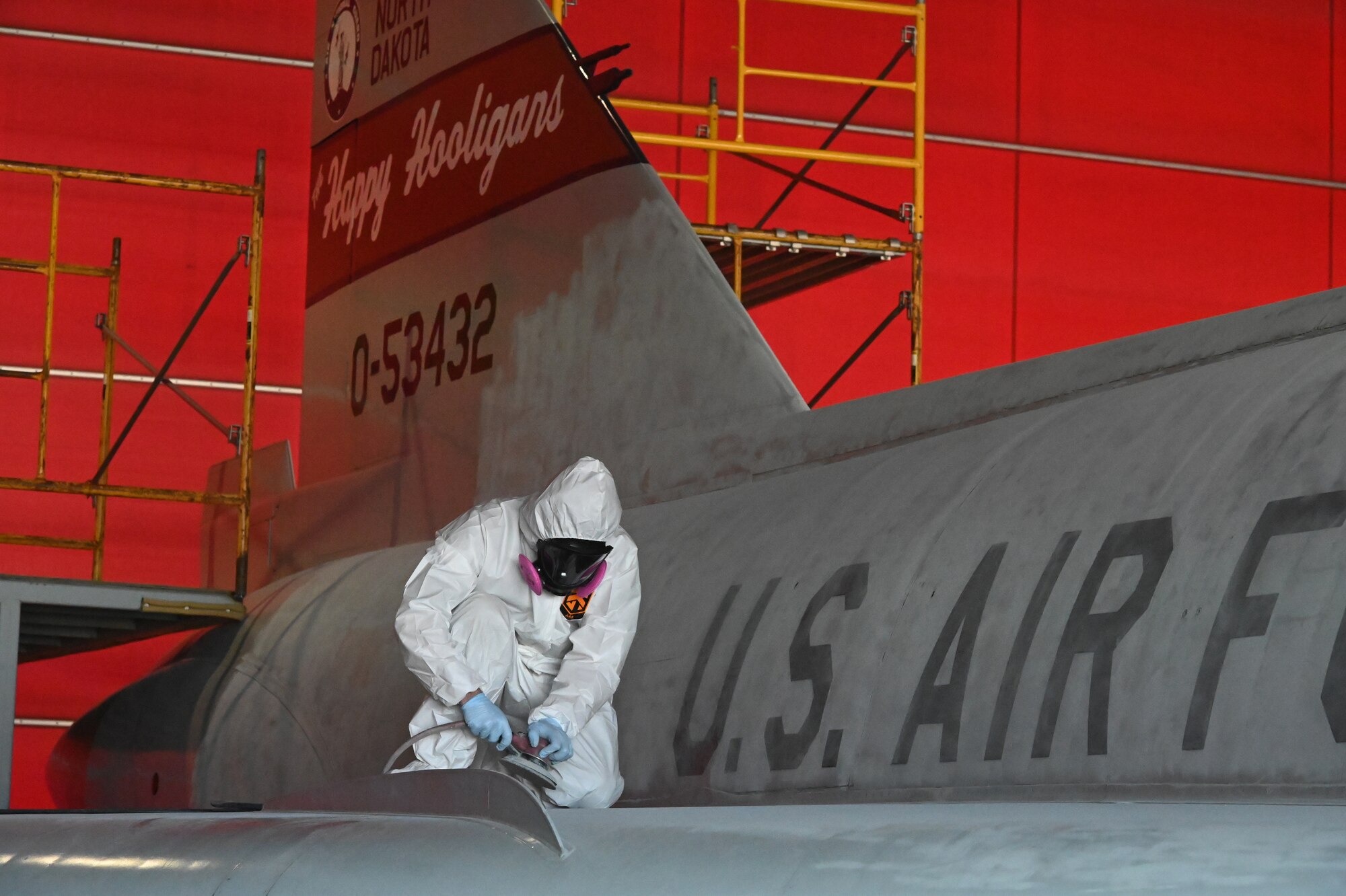 Staff Sgt. Anthony Walp, 119th Aircraft Maintenance Squadron, prepares the surface of an F-102 Delta Dagger static aircraft for a fresh coat of paint at North Dakota Air National Guard Base, Fargo, N.D., June 11, 2020. The aircraft will be returned to Heritage Park when restoration is complete. The North Dakota Air National Guard flew the F-102 from 1966-1969 and the Air Force eventually retired the airframe from operational service in 1976. (U.S. Air National Guard photo by David H. Lipp)