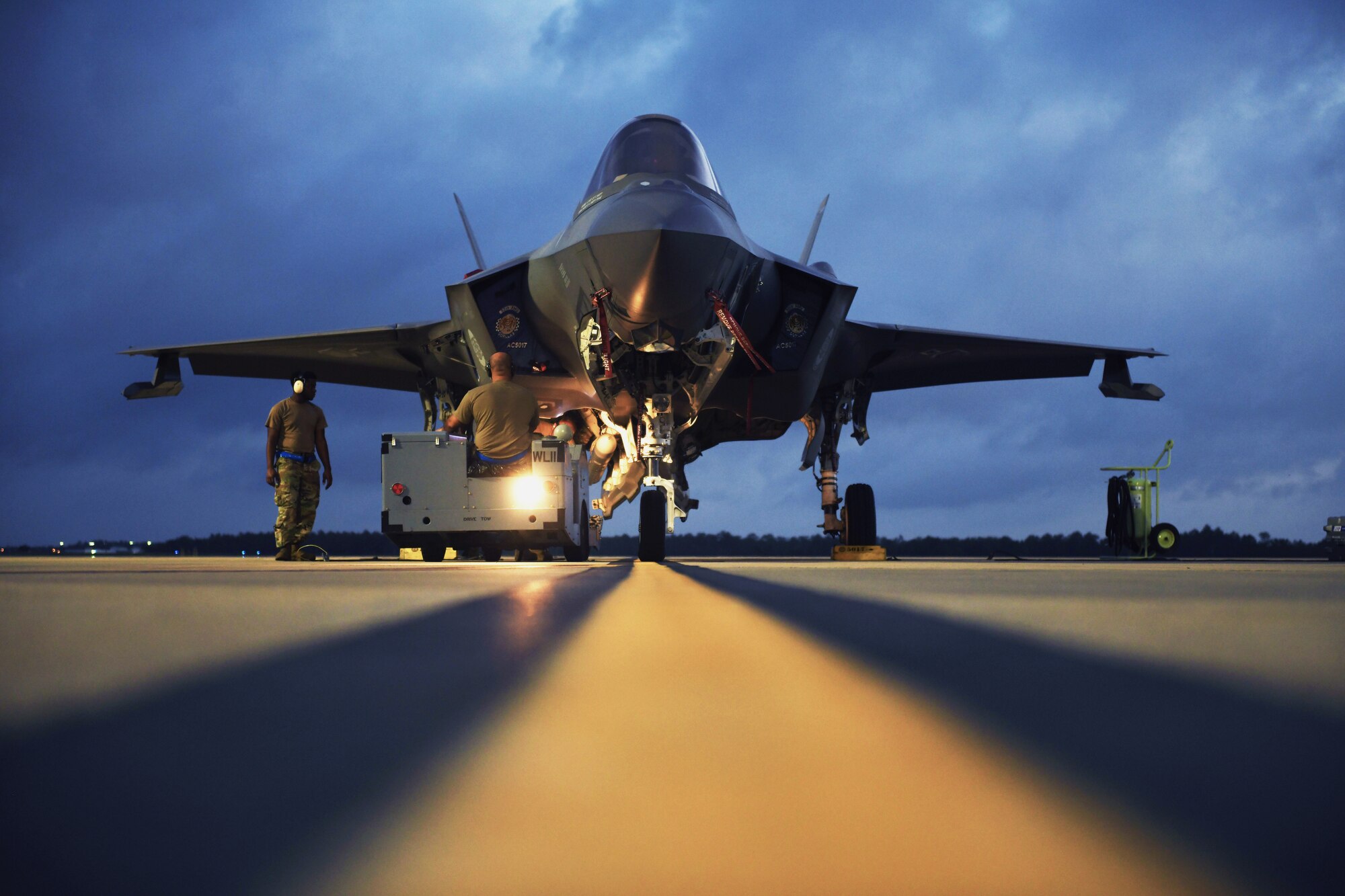 Weapons load crew members assigned to the 58th Aircraft Maintenance Unit load an AIM-120 advanced medium-range air-to-air missile to an F-35 Lightning II during exercise Combat Archer at Eglin Air Force Base, Fla., June 10, 2020. The AMRAAM is faster, smaller and lighter with improved capabilities against low-altitude targets. (U.S. Air Force photo by Airman 1st Class Heather Leveille)