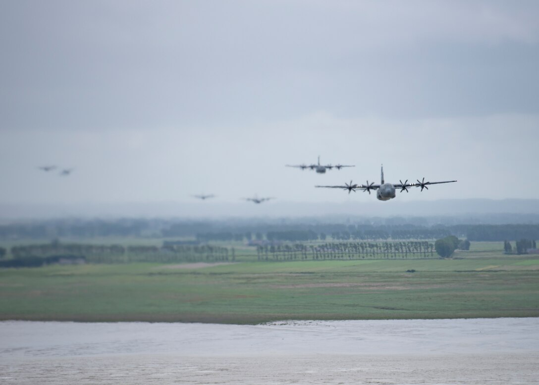 A C-130J Super Hercules flies through French airspace June 6, 2020. To commemorate the 76th anniversary of D-Day, eight C-130J aircraft from the 37th Airlift Squadron at Ramstein Air Base, Germany, performed low-level formations over several different locations in France. (U.S. Air Force photo by Staff Sgt. Kirsten Brandes)