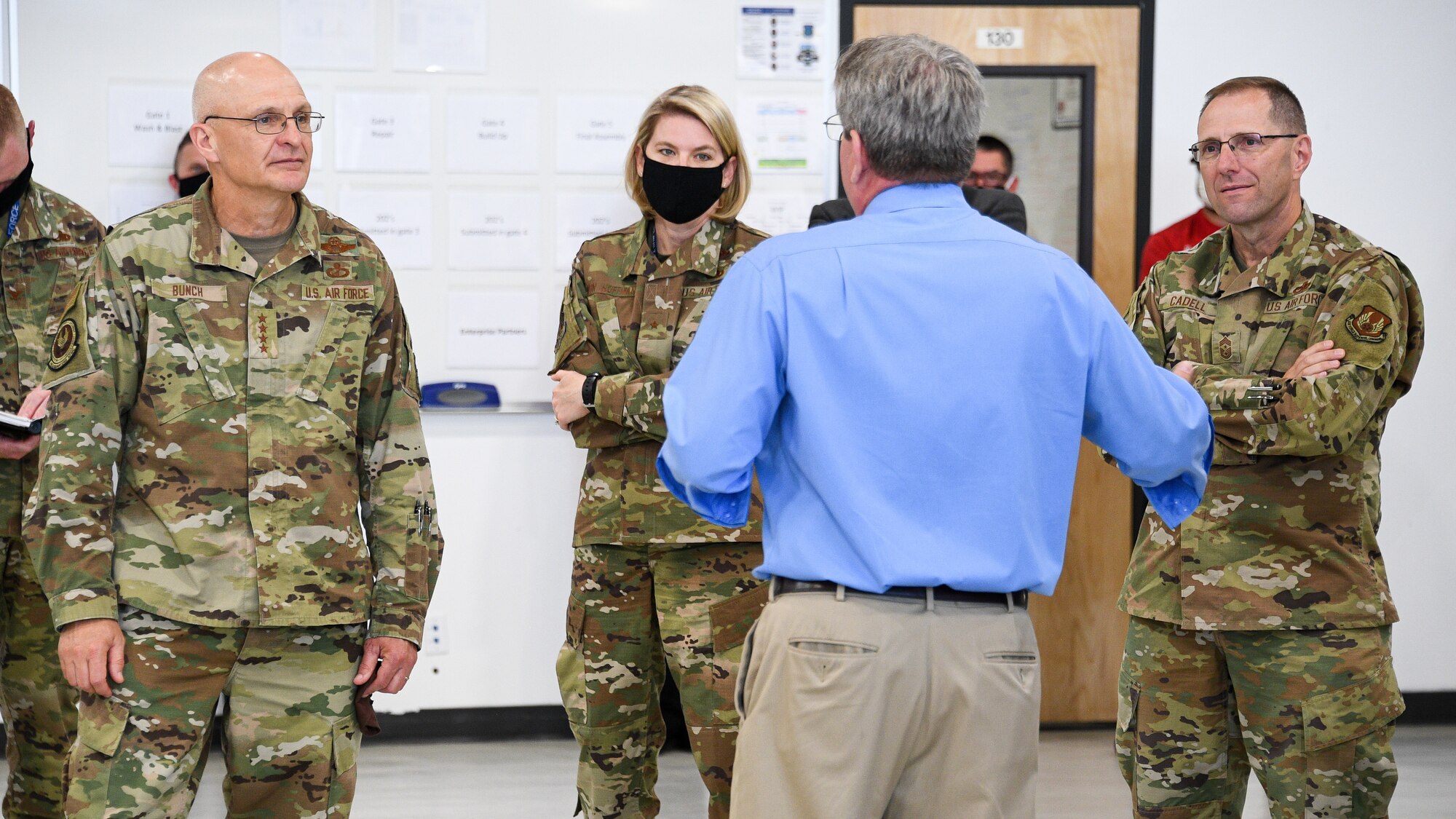 Gen. Bunch and Chief Master Sgt. Cadell are being briefed by leadership with the 309th Commodities Maintenance Group.