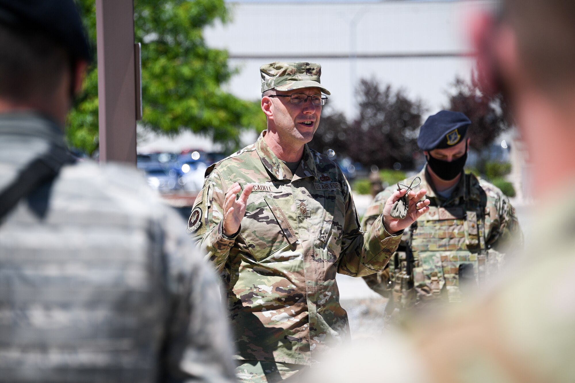 Chief Master Sgt. Cadell speaks with Airmen standing in formation from the 75th Security Forces Squadron.