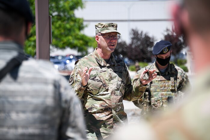 Chief Master Sgt. Cadell speaks with Airmen standing in formation from the 75th Security Forces Squadron.