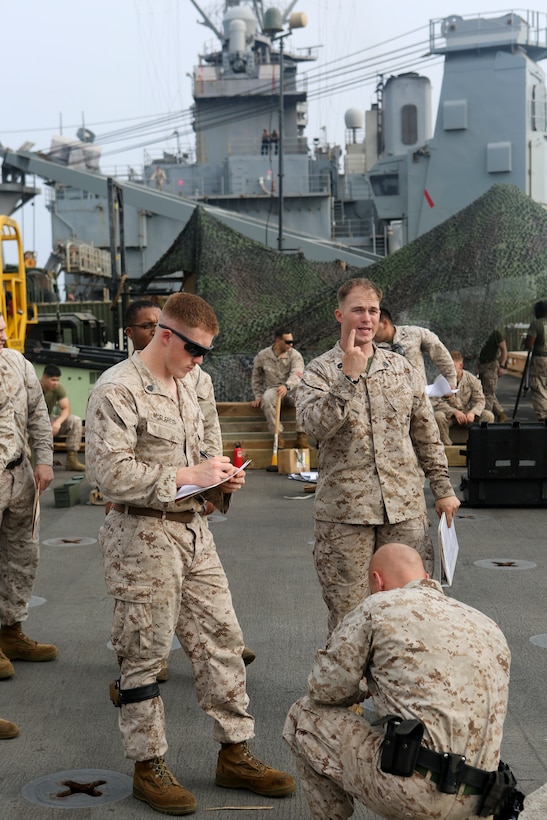 200610-M-CB805-1017 RED SEA (June 10, 2020) U.S. Marine Corps Gunnery Sgt. Joshua Nicholson, engineering chief, Combat Logistics Battalion 26, 26th Marine Expeditionary Unit (MEU), gives a weapons safety brief prior to a pistol qualification range aboard the amphibious dock landing ship USS Oak Hill (LSD 51) June 10, 2020. Oak Hill with embarked 26th MEU is deployed to the U.S. 5th Fleet area of operations in support of naval operations to ensure maritime stability and security in the Central Region, connecting the Mediterranean and Pacific through the Western Indian Ocean and three critical chokepoints to the free flow of global commerce. (U.S. Marine Corps photo by Staff Sgt. Pablo D. Morrison)