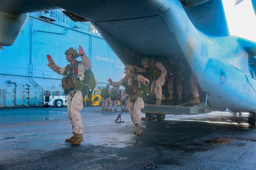 200506-M-IR130-1021 ARABIAN GULF (May 6, 2020) Reconnaissance Marines assigned to the Maritime Raid Force, 26th Marine Expeditionary Unit (MEU), walk through the procedures of a free-fall insert aboard the amphibious assault ship USS Bataan May 6, 2020. Bataan, with embarked 26th MEU, is deployed to the U.S. 5th Fleet area of operations in support of naval operations to ensure maritime stability and security in the Central Region, connecting the Mediterranean and Pacific through the Western Indian Ocean and three strategic choke points. (U.S. Marine Corps photo by Cpl. Gary Jayne III)