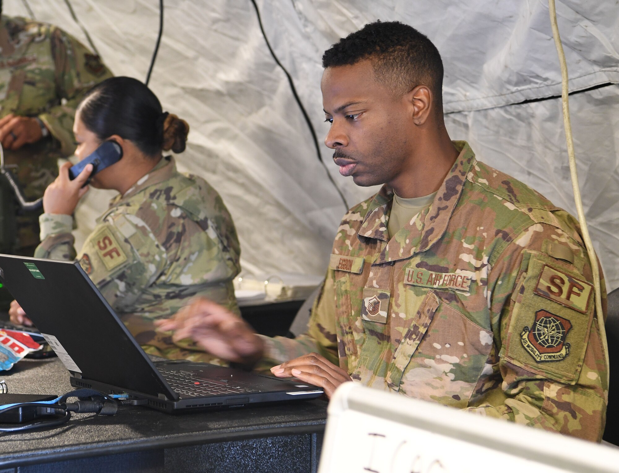 Master Sgt. Regis Egbon, 321st Contingency Response Squadron force protection chief and exercise defense force commander, observes security forces responding to an
exercise incident June 9, 2020, at Joint Base McGuire-Dix-Lakehurst, New Jersey. The exercise was developed to improve Mission Planning Cell effectiveness and Tactical Operations Center synergy while assisting Airmen in upgrade training. (U.S. Air Force photo by Tech. Sgt. Luther Mitchell)