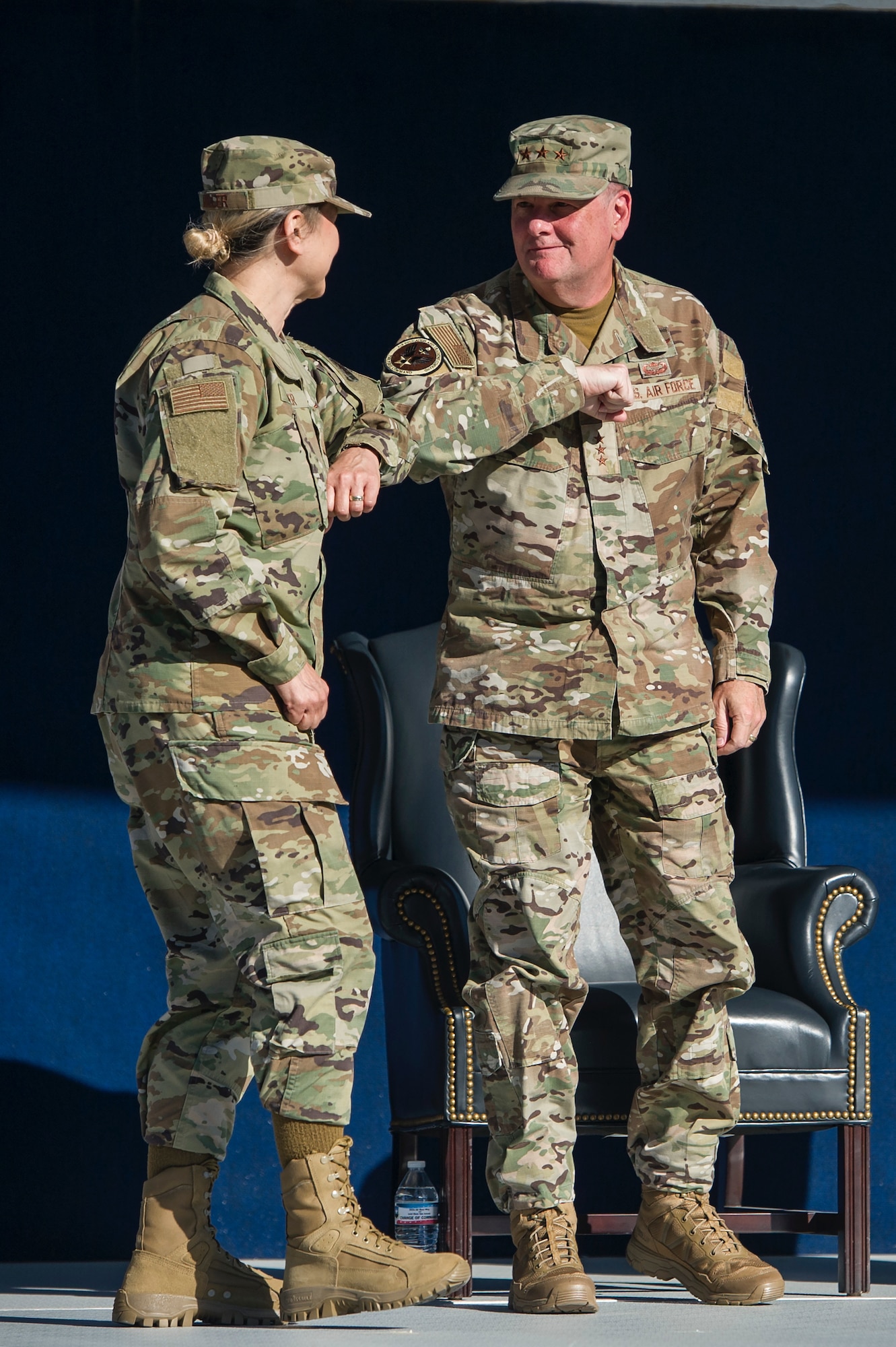 Brig. Gen. Caroline Miller, (left) the incoming commander for the 502d Air Base Wing and Joint Base San Antonio, bumps elbows with Lt. Gen. Marshall "Brad" Webb, the Air Education and Training Command commander, during a change of command ceremony June 12 at JBSA-Fort Sam Houston.