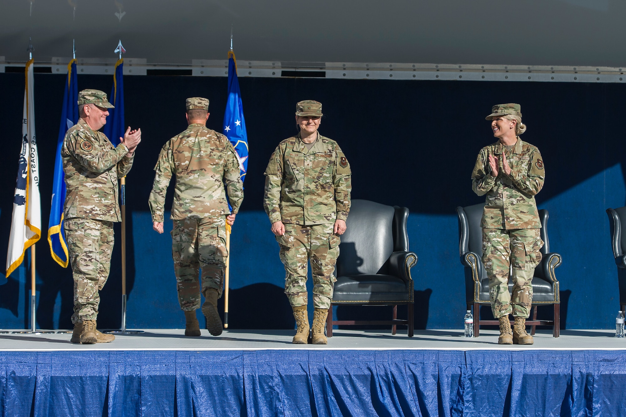 Lt. Gen. Brad Webb, the Air Education and Training Command commander (left), and Brig. Gen. Laura Lenderman, the former 502d Air Base Wing and Joint Base San Antonio commander (right), congratulate Brig. Gen. Caroline Miller, the wing's newest commander, during a change of command ceremony June 12 at JBSA-Fort Sam Houston.