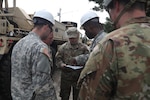 In this Sept. 8, 2019, photo, North Carolina National Guard Soldiers conduct recovery and logistics operations on Ocracoke Island in support of Hurricane Dorian. More than 500 Guard members and 183 vehicles were deployed to help in eastern North Carolina.