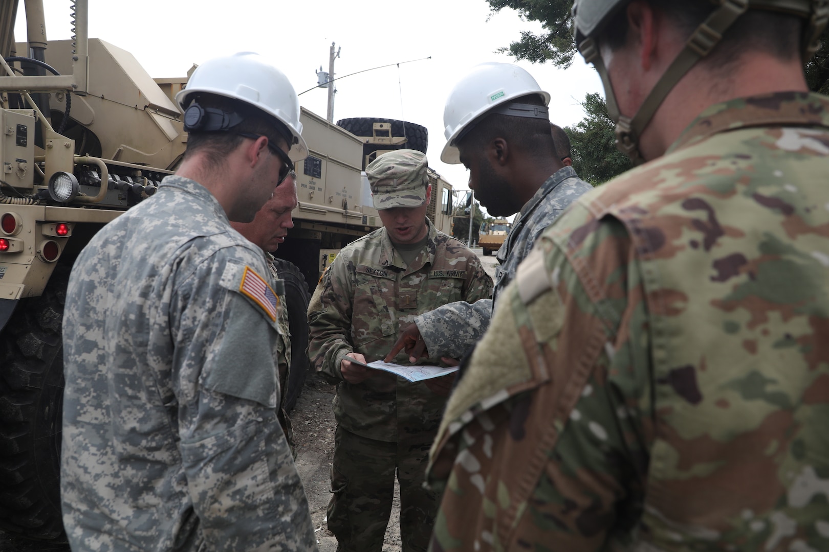 In this Sept. 8, 2019, photo, North Carolina National Guard Soldiers conduct recovery and logistics operations on Ocracoke Island in support of Hurricane Dorian. More than 500 Guard members and 183 vehicles were deployed to help in eastern North Carolina.