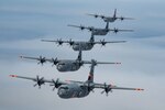 Five of six California Air National Guard C-130J Super Hercules aircraft fly in tight formation over the Pacific Ocean May 27, 2020. California Air National Guard maintainers from the 146th Maintenance Group and aircrew from the 115th Airlift Squadron collaborated to accomplish the launch.