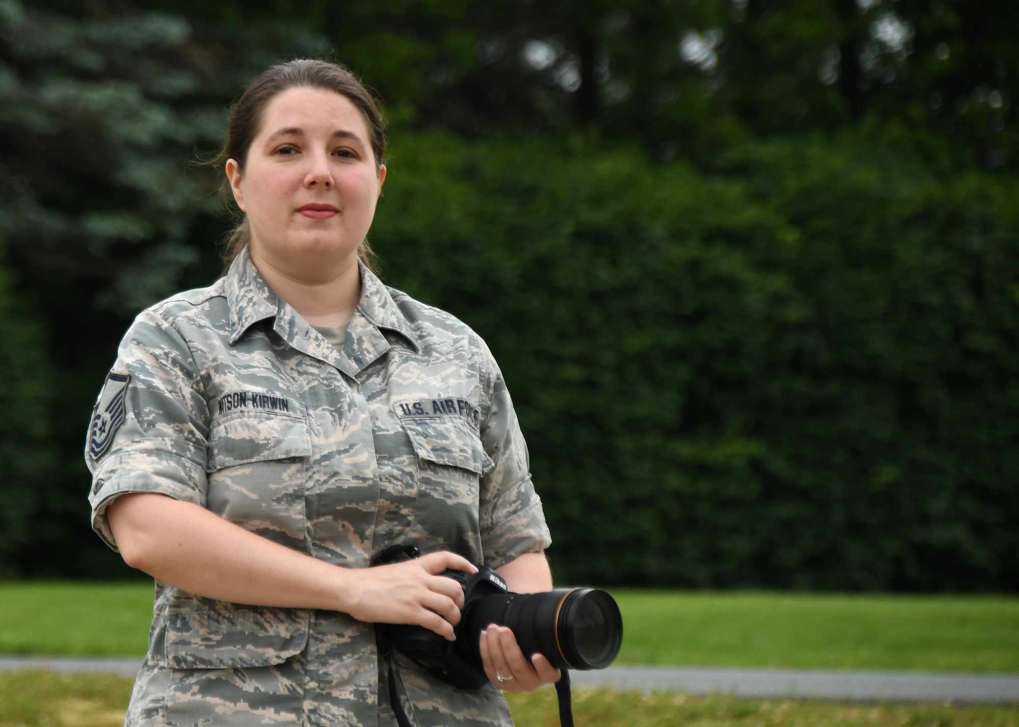 BARNES AIR FORCE BASE, Mass. -- Master Sgt. Lindsey Sarah Watson-Kirwin, 104th Fighter Wing, Massachusetts Air National Guard, poses with her camera, June 11, 2020. (U.S. Air National Guard photo by Airman 1st Class Sara Kolinski)
