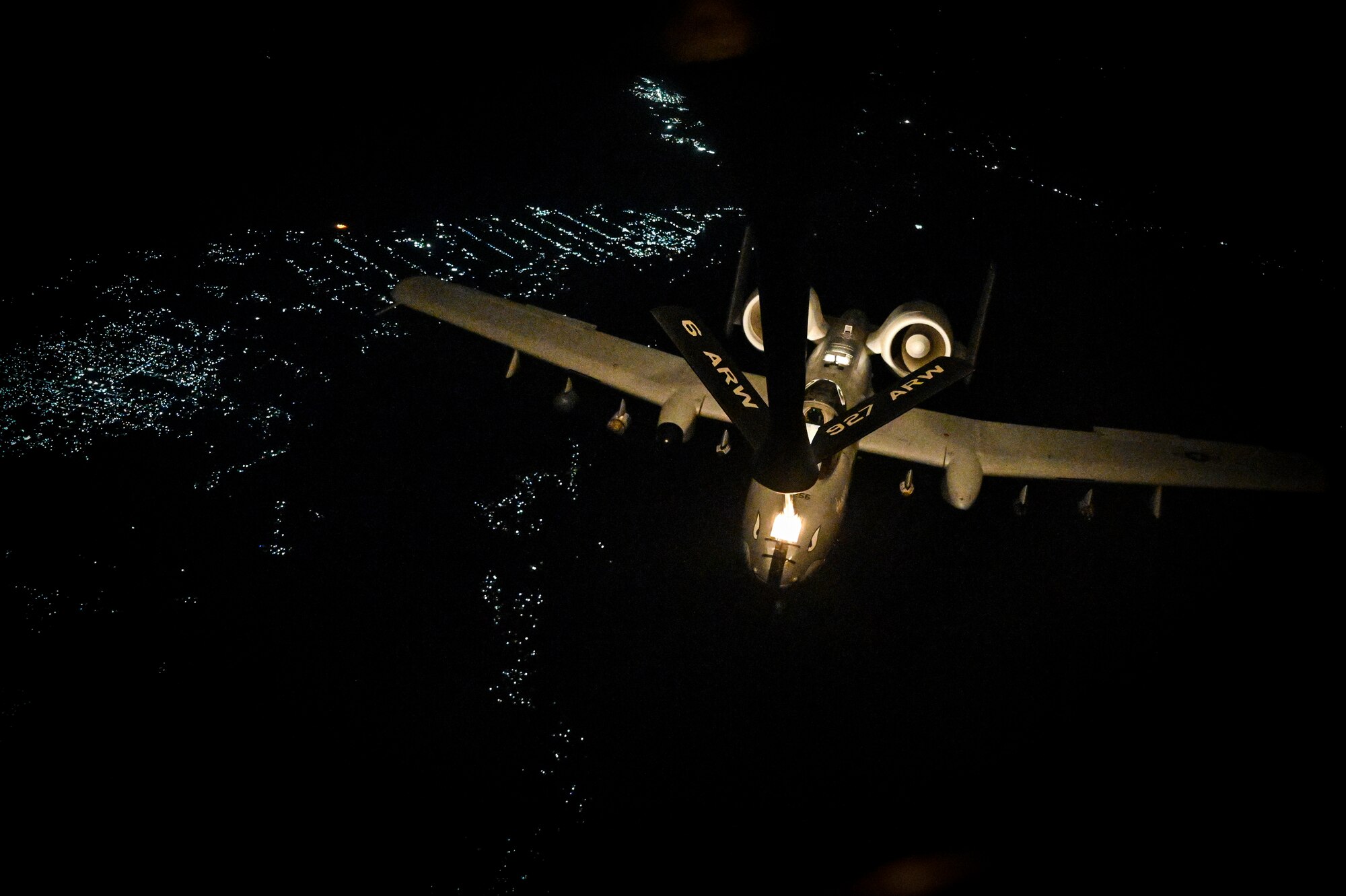 A U.S. Air Force A-10 Thunderbolt II is in-air refueled by a KC-135 Stratotanker with the 28th Expeditionary Air Refueling Squadron assigned to Al Udeid Air Base, Qatar, over Afghanistan, May 21, 2020.