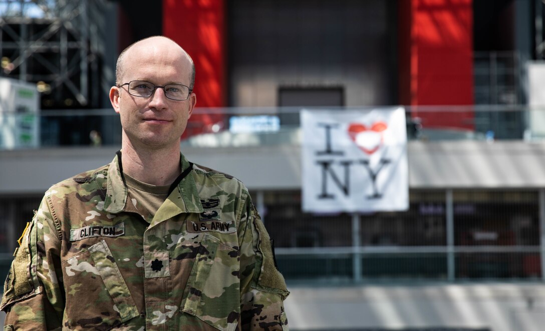 Army doctor in uniform poses for a photo.