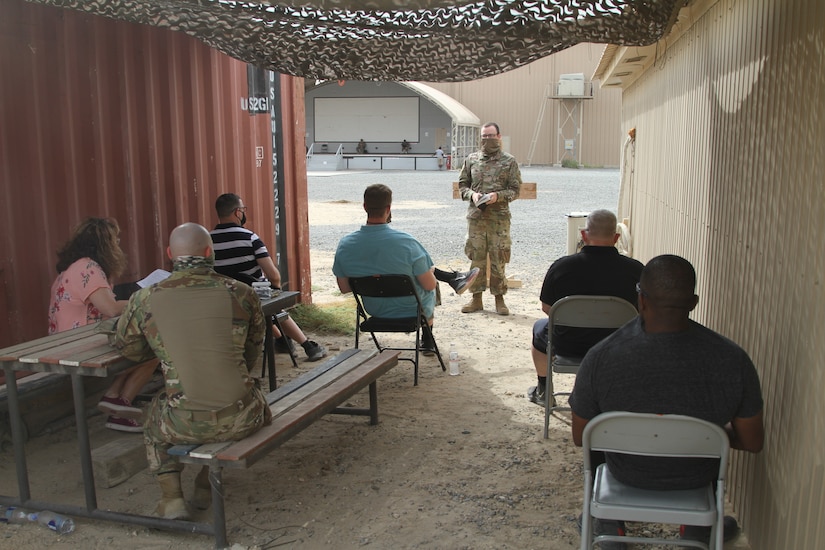 U.S. Army Maj. Timothy Miller, the Task Force Spartan Deputy Command Chaplain, assigned to the 42nd Infantry Division, gives a Christian Service in the Central Command Area of Operation, May 10, 2020. Miller gave the outdoor services in compliance with Department of Defense guidelines. (U.S. Army photo by Sgt. Andrew Valenza)