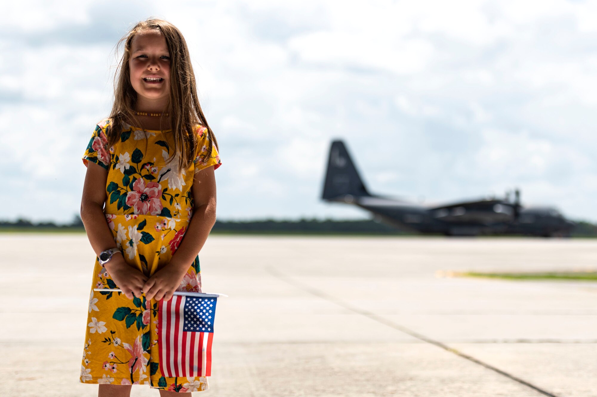 Photo of a child posing for a photo.