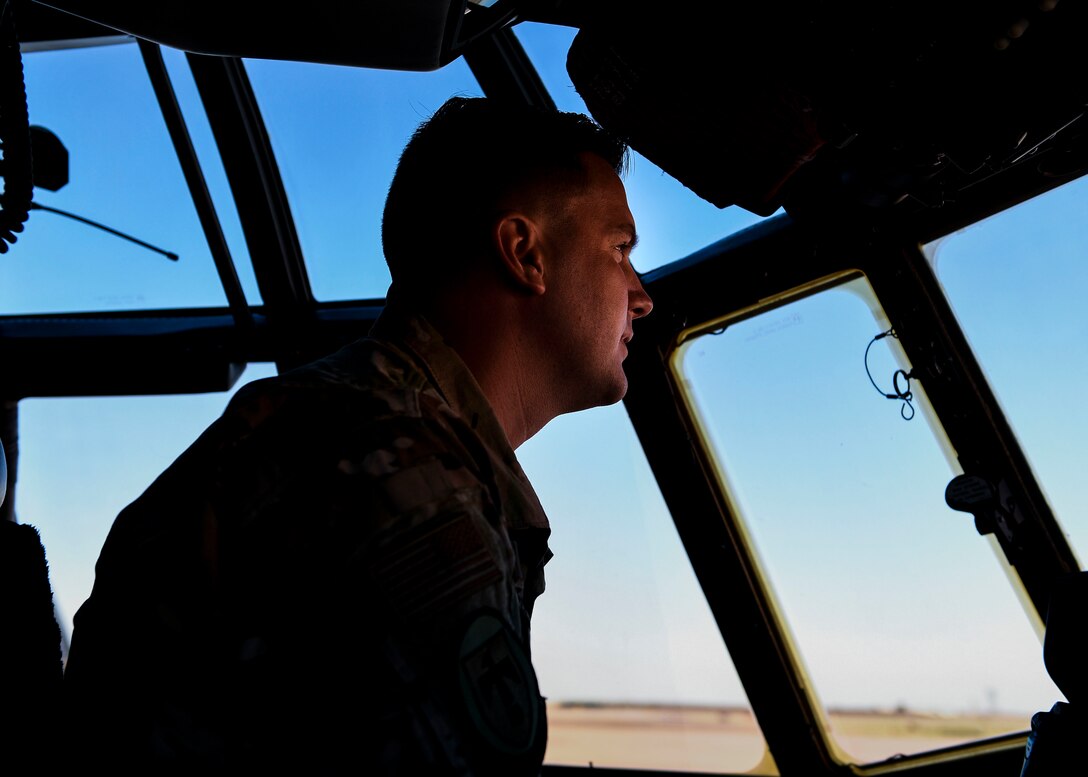 An Airman performs a pre-flight inspection.