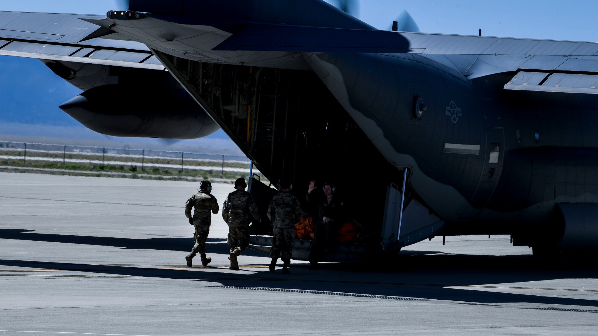 Airmen board an aircraft.