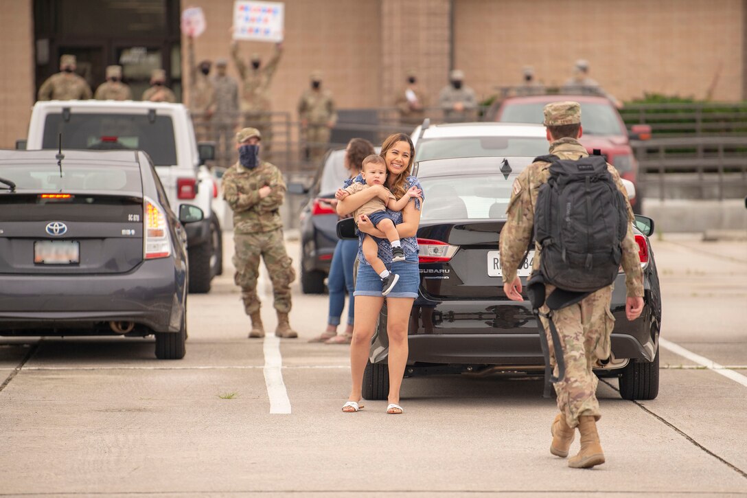An Airman assigned to the 23d Maintenance Group reunites with family after a 5-month deployment June 10, 2020 at Moody Air Force Base, Georgia. Approximately 300 members assigned to the 74th EFS returned from deployment June 10-12. The 74th Expeditionary Fighter Squadron, which consisted of personnel from the 23d Fighter Group and 23d Maintenance Group, were deployed as a part of Operation Freedom Sentinel. (U.S. Air Force photo by 2nd Lt. Kaylin P. Hankerson)
