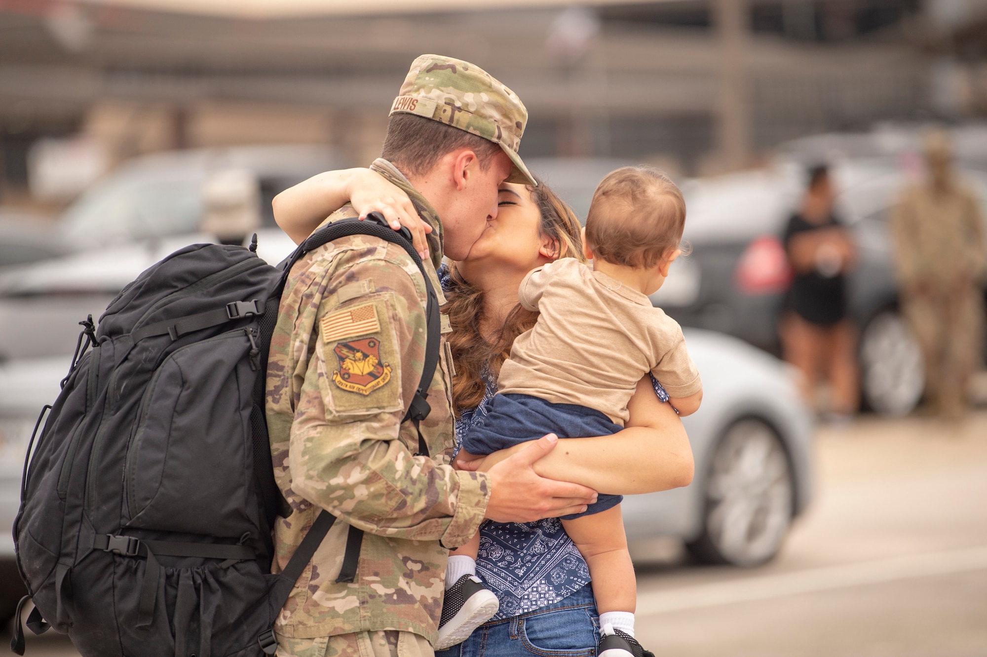 An Airman assigned to the 74th Expeditionary Fighter Squadron embraces his family after a 5-month deployment June 10, 2020, at Moody Air Force Base, Georgia. Approximately 300 members assigned to the 74th EFS returned from deployment June 10-12. The 74th EFS, which consisted of personnel from the 23d Fighter Group and 23d Maintenance Group, were deployed as a part of Operation Freedom Sentinel. (U.S. Air Force photo by 2nd Lt. Kaylin P. Hankerson)