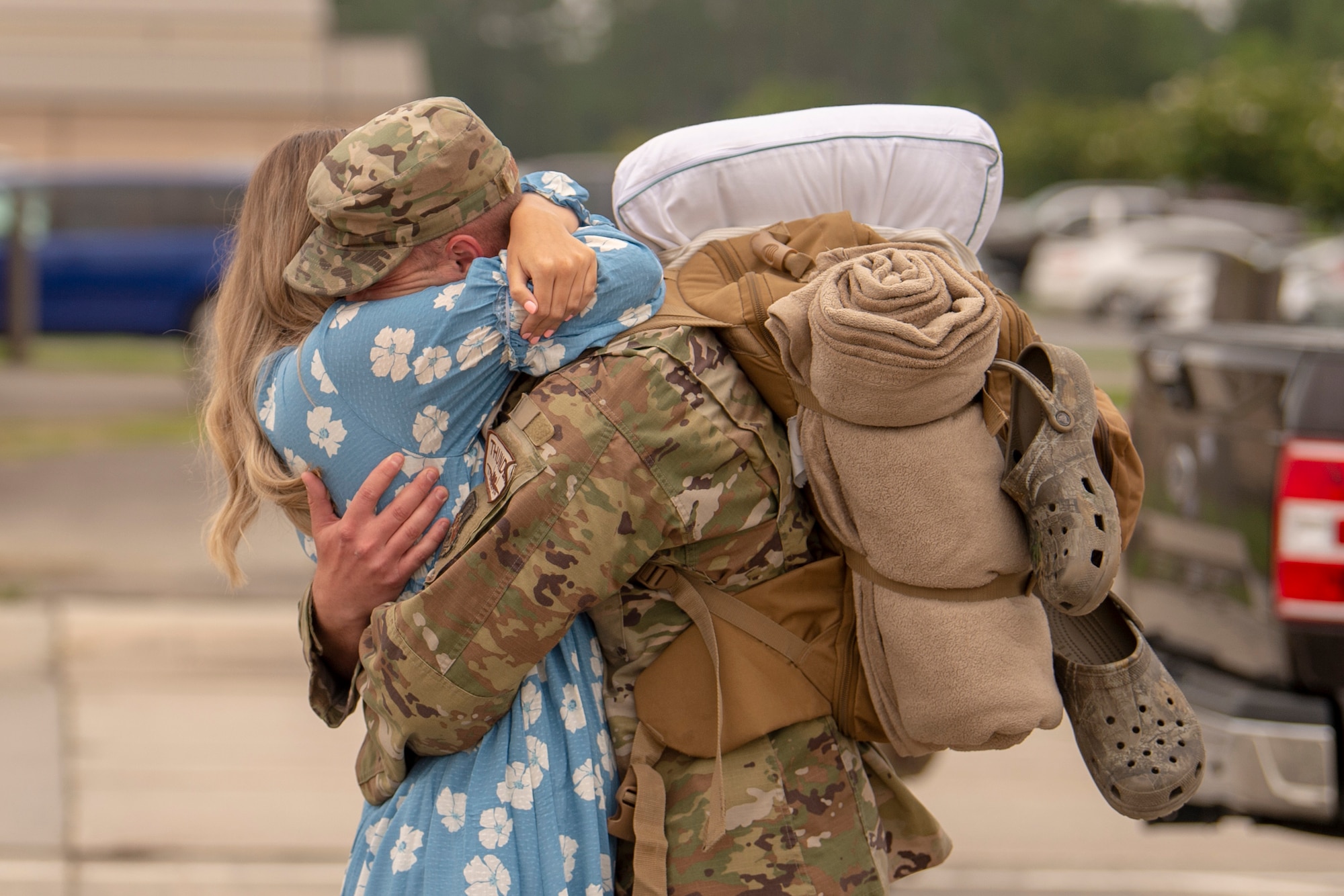An Airman assigned to the 74th Expeditionary Fighter Squadron reunites with his significant other after a 5-month deployment June 10, 2020, at Moody Air Force Base, Georgia. Approximately 300 members assigned to the 74th EFS returned from deployment June 10-12. The 74th EFS, which consisted of personnel from the 23d Fighter Group and 23d Maintenance Group, were deployed as a part of Operation Freedom Sentinel. (U.S. Air Force photo by 2nd Lt. Kaylin P. Hankerson)